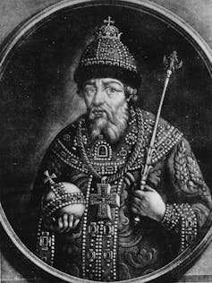 The depiction of a man in medieval attire.