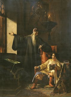 A painting shows an old man with a beard and a seated man.