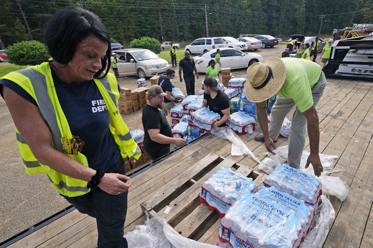 Jackson City firefighters and volunteers help distribute over 40,000 bottles of water to Jackson residents