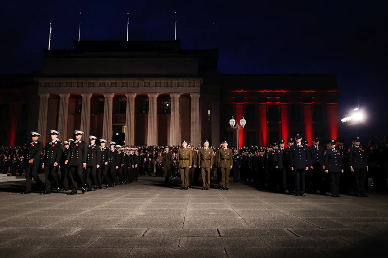Military personal march during the Anzac Day dawn service at Auckland War Memorial Museum