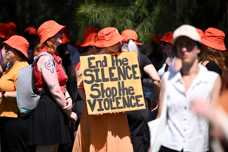 A protest sign that says end the silence stop the violence