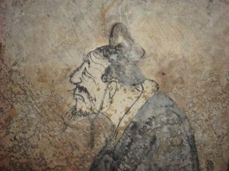 Ancient tomb painting of the head of Confucius.