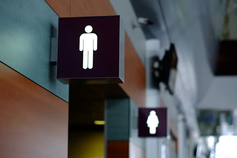 Photo of male and female toilet signs in a public building