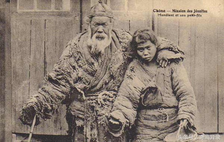A Chinese grandfather and grandson beg for food.