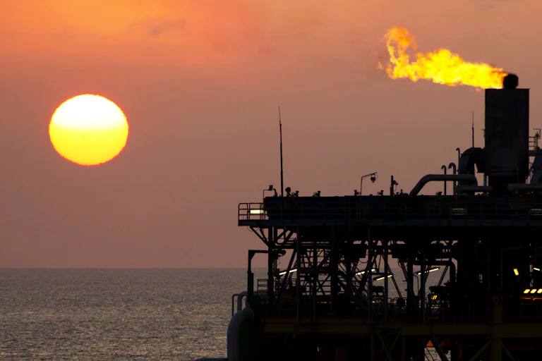 Offshore oil platform at sunset