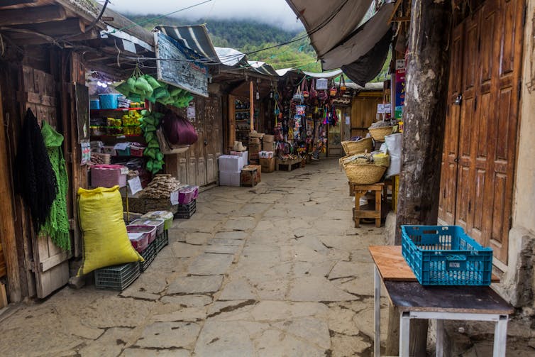 Wooden buildings act as shop fronts.