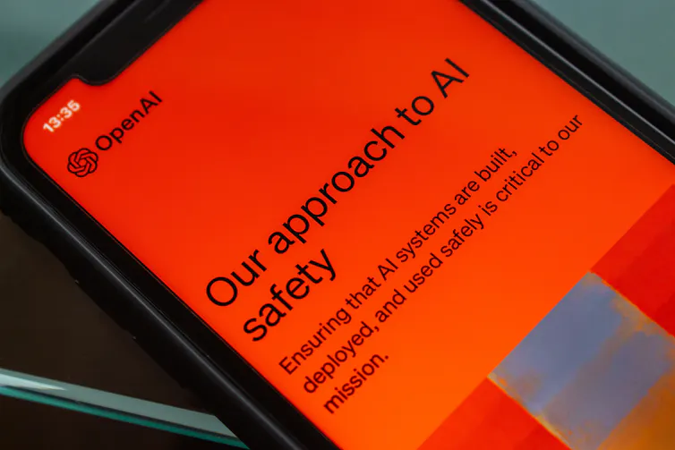 a phone screen with the OpenAI logo and the text