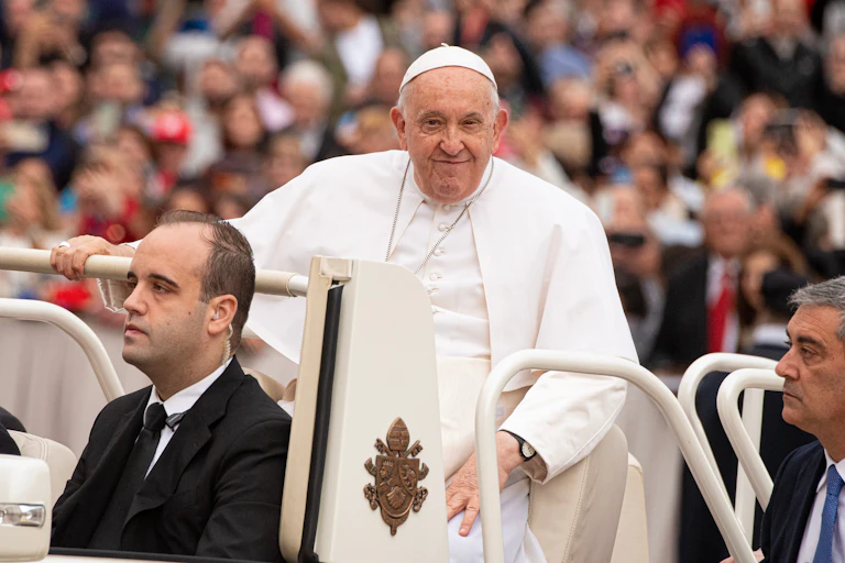 Pope Francis greets visitors at Saint Peter's Square.