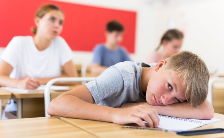 Boy looking bored in classroom