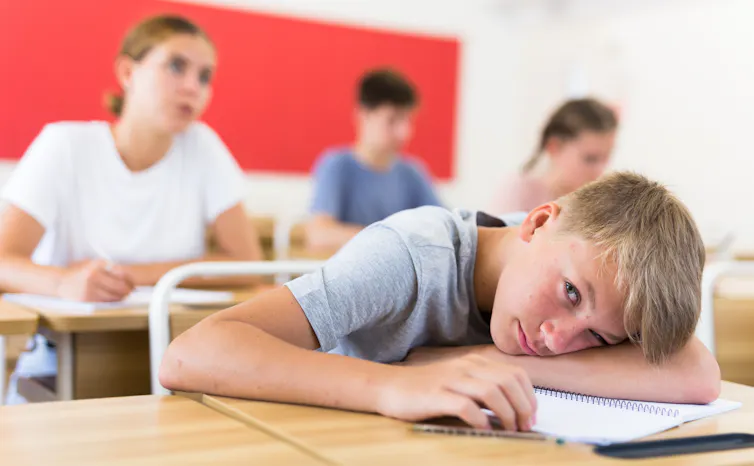 Boy looking bored in classroom