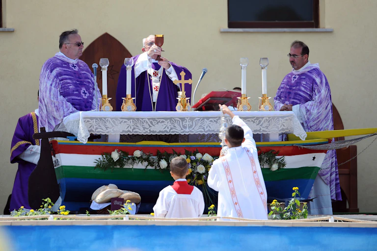 Pope Francis I celebrates mass on the Italian island of Lampedusa on an altar shaped as a ship.