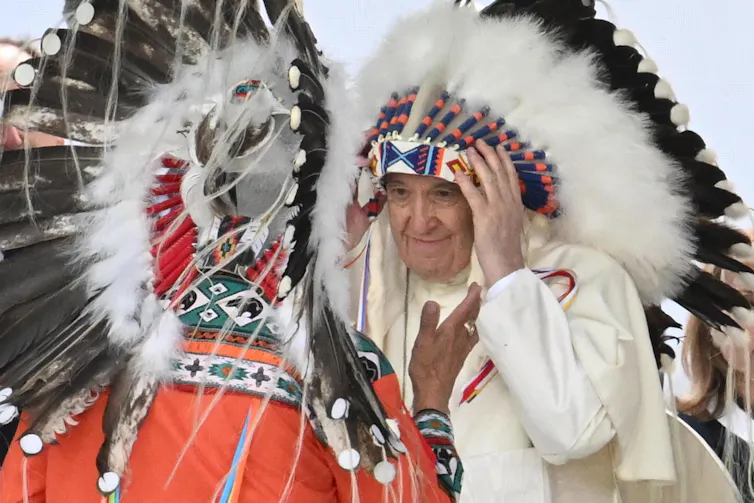 Pope Francis in native american headdress