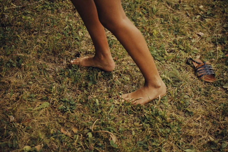Feet on soil.