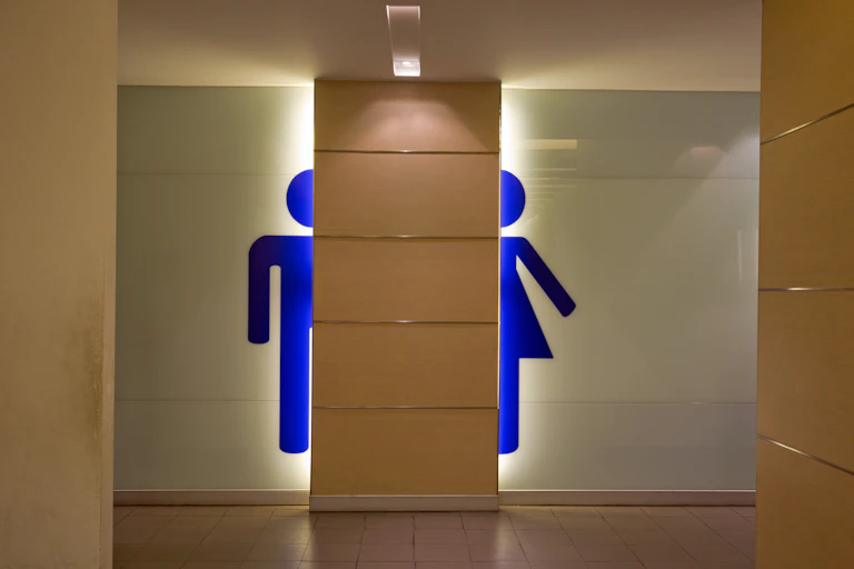 Entrance to a public restroom showing men's and women's toilets