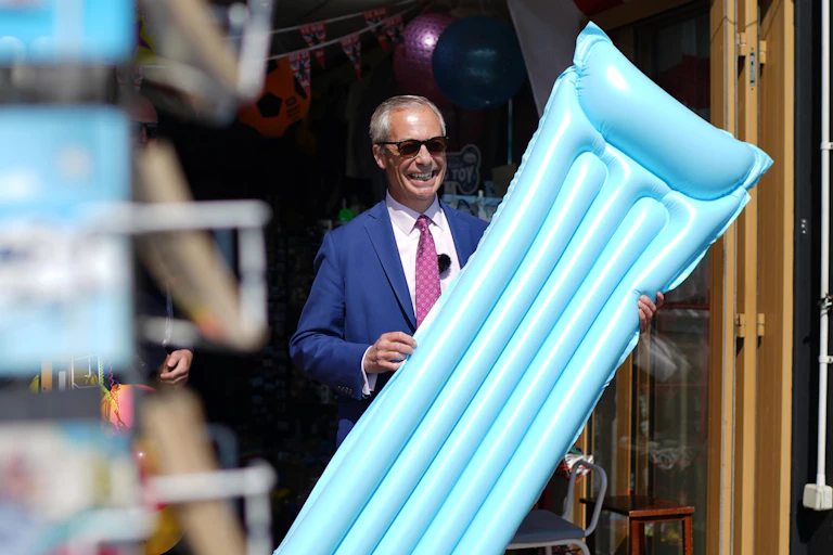 Nigel Farage holding a lilo.