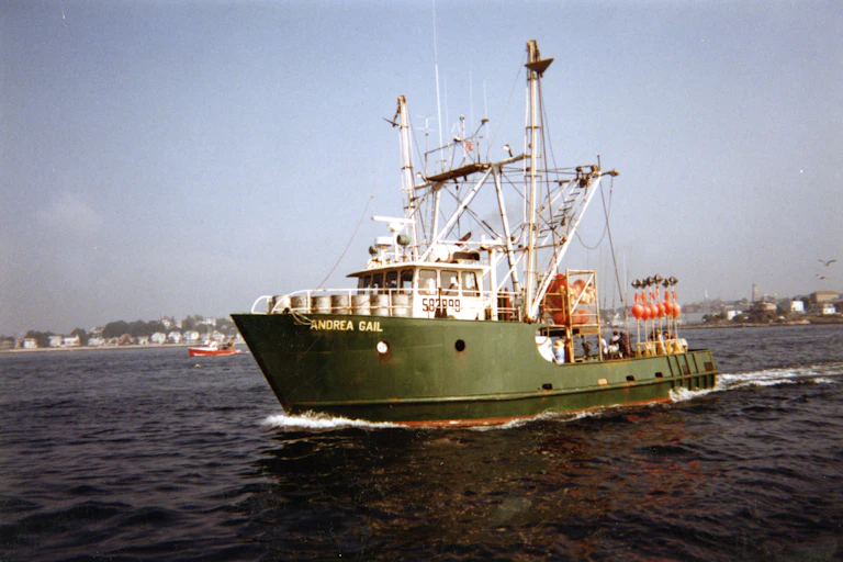 A ship with the words 'Andrea Gail' sails in Gloucester Harbor during filming of 'The Perfect Storm'