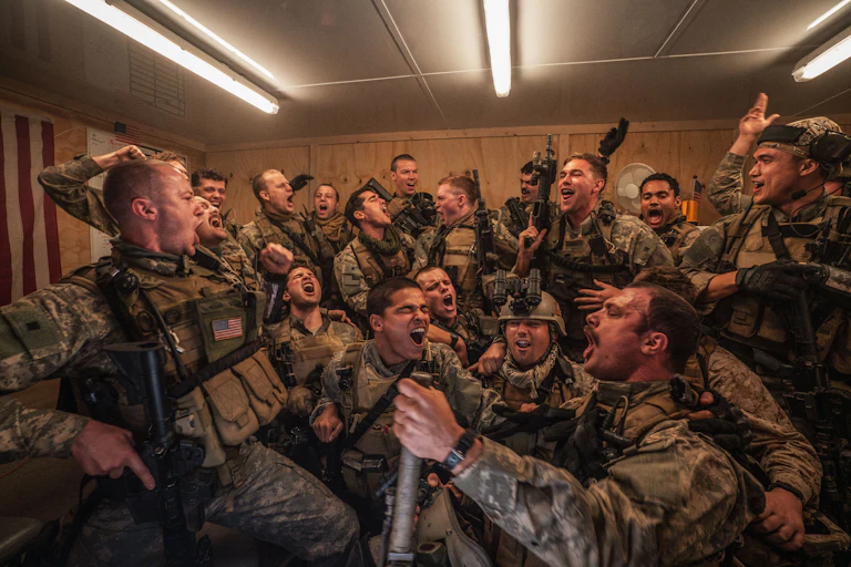 A group of men in Seals uniforms shouting and celebrating together.