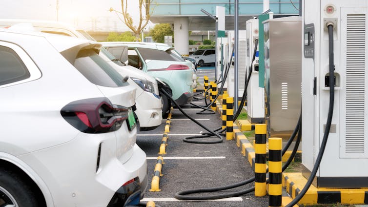 Electric vehicles being charged