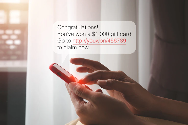 Person about to click on a scam link on their phone.