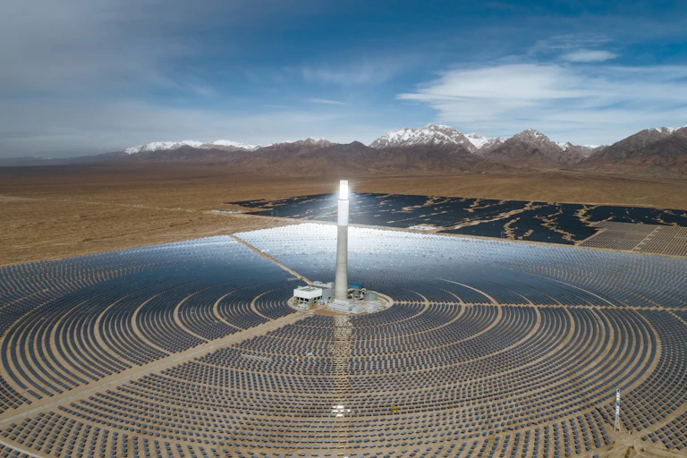 Solar farm with mountains in background