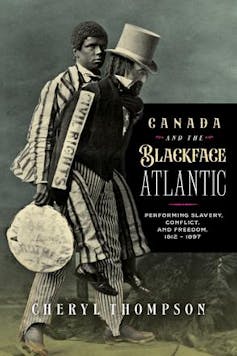 a black-and-white photo shows a black man walking next to a white man