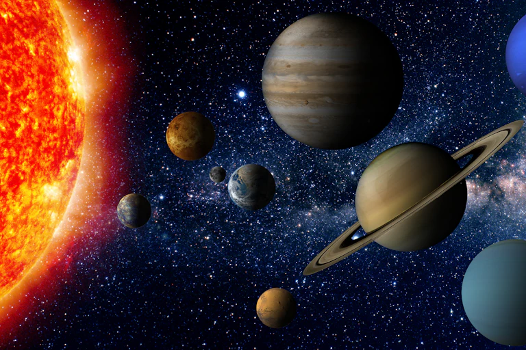 Against the blackness of space, eight planets and a glowing orange and yellow Sun appear in this artist's depiction of the solar system.