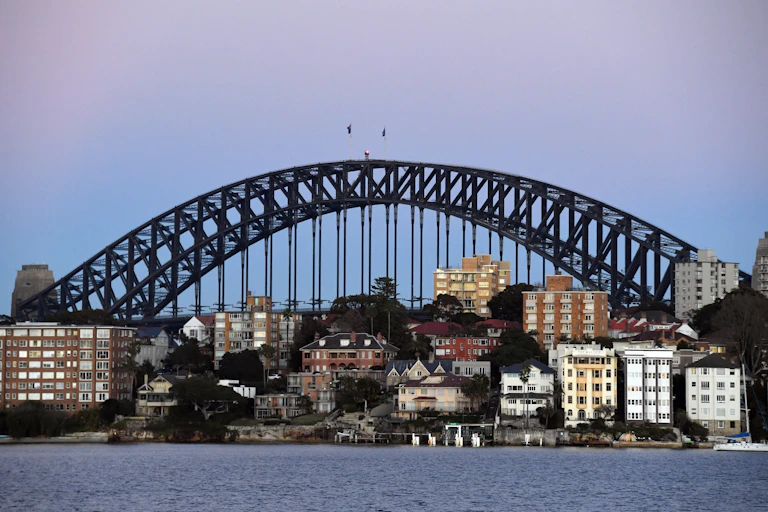 Houses and apartments seen in front of Sydney Harbour Bridge