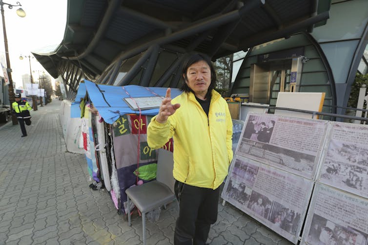In this April 2, 2019, photo, Choi Seung-woo, a victim of Brothers Home, speaks during an interview in front of National Assembly in Seoul, South Korea.