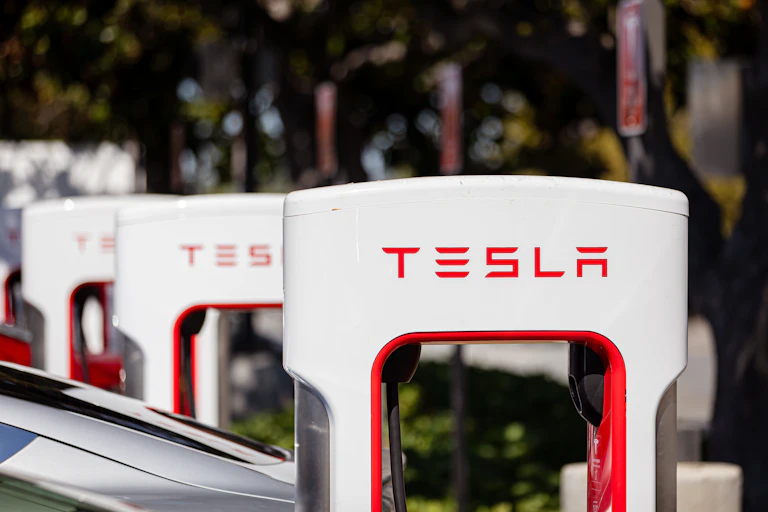 row of tesla charging points