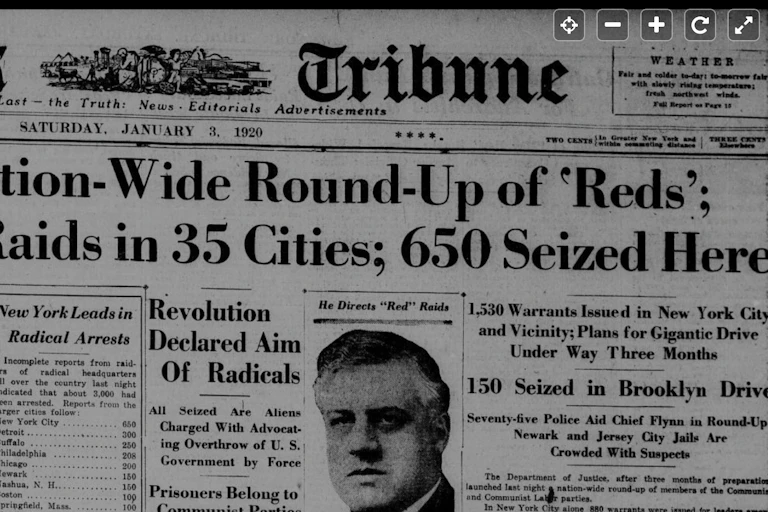 A portion of a newspaper with a huge headline announcing a massive roundup of immigrants deemed to be communists.