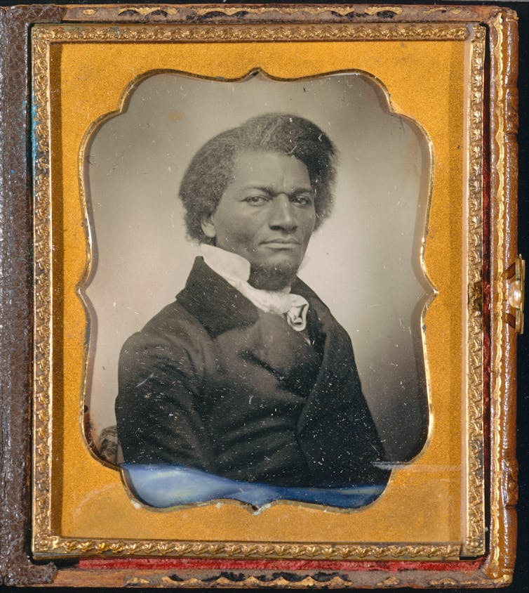 A very handsome black man in a suit.