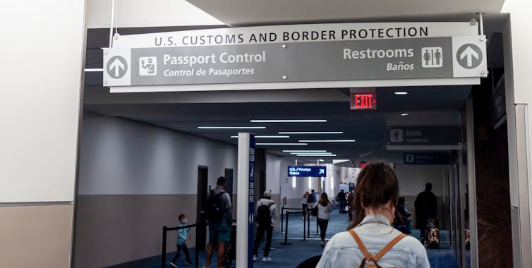International Arrival terminal of the Atlanta Hartsfield Jackson Airport. Signs direct passengers to U.S. Border protection