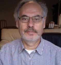 Palestinian literature: a wealthy literary heritage from a country in exile 5 A middle-aged balding man with grey hair wearing a pale blue and white striped shirt.