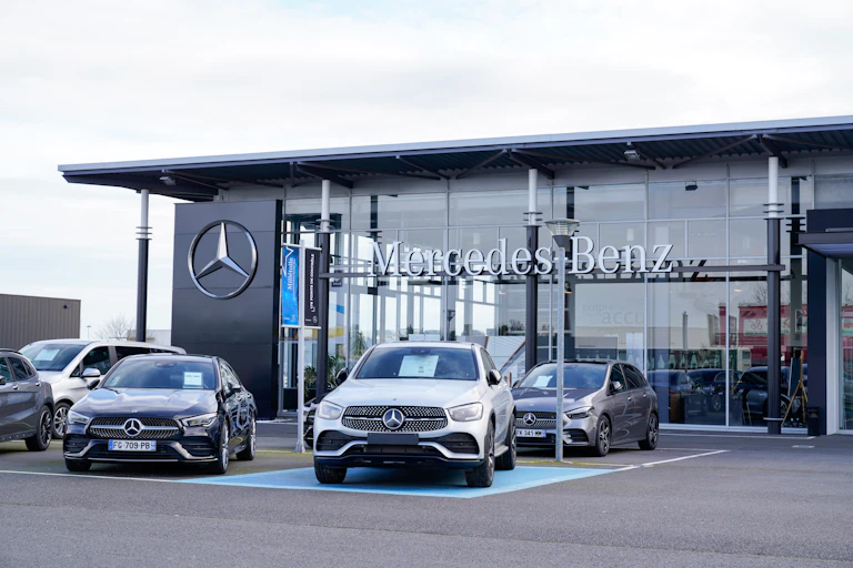 mercedes cars lined up outside a dealership in france