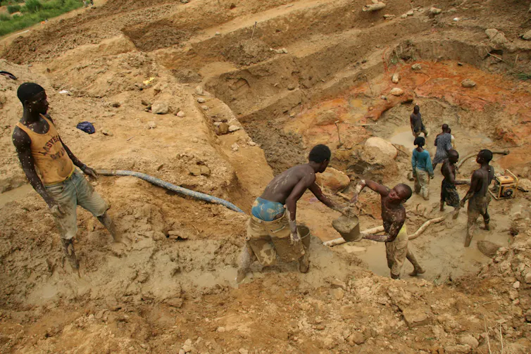 Sierra Leonian miners working in diamond fields.