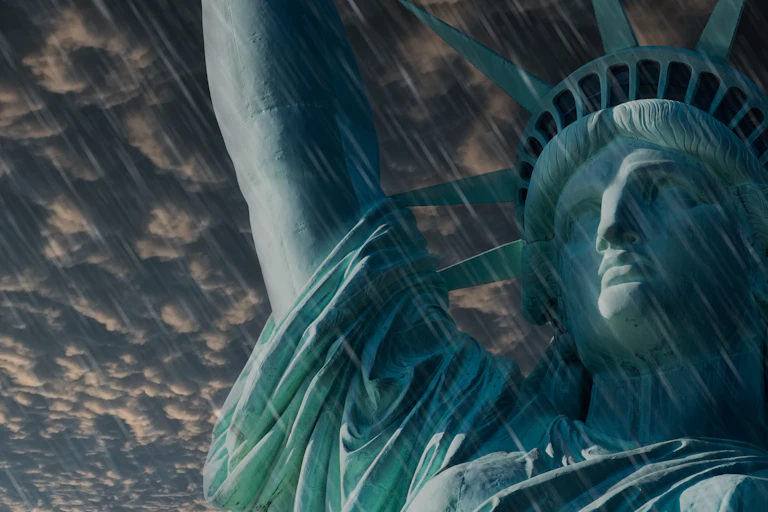 cLOSE UP STATUE OF LIBERTY WITH HEAVY RAIN