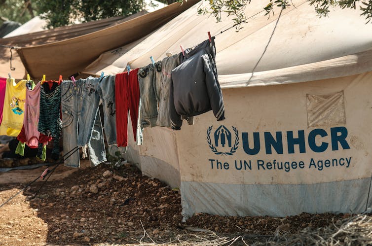Washing hangs on a line in a UNHCR refugee camp.