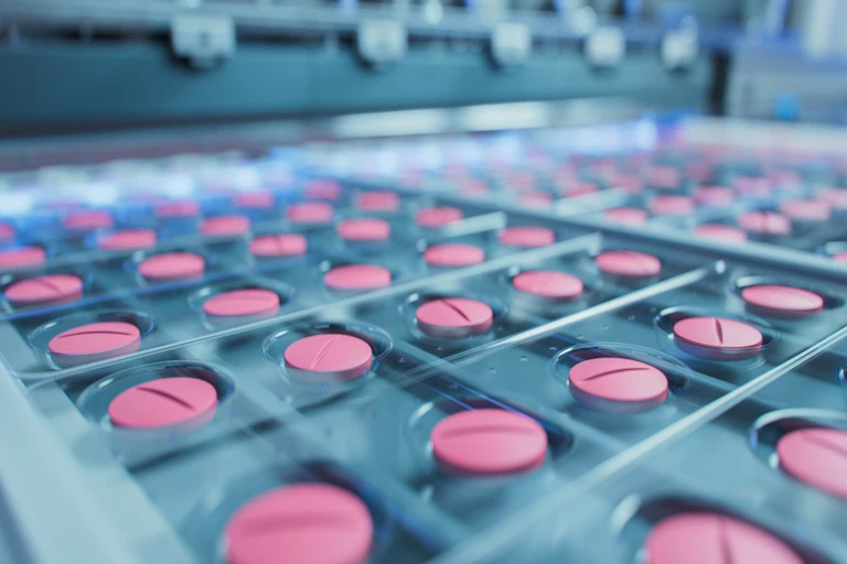 Pills in blister packs on production line