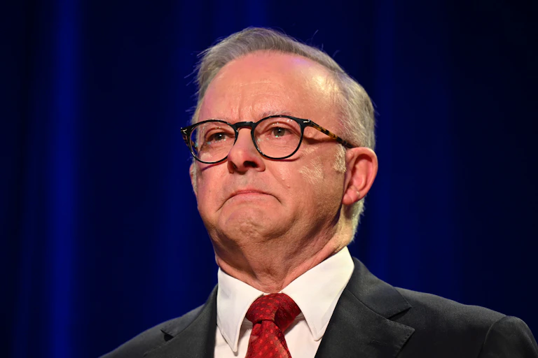 A close up of Anthony Albanese crying