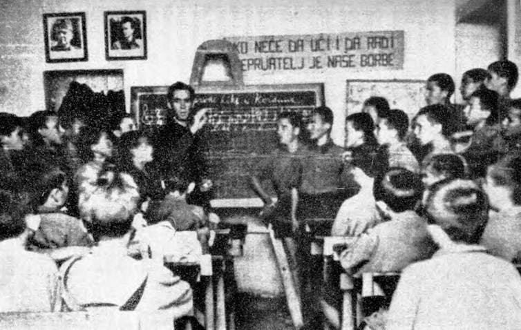 Italy’s spaces of wartime fascist resistance stay much less prone to the a long way appropriate lately 3 A black and white photo of a wartime schoolroom full of students.