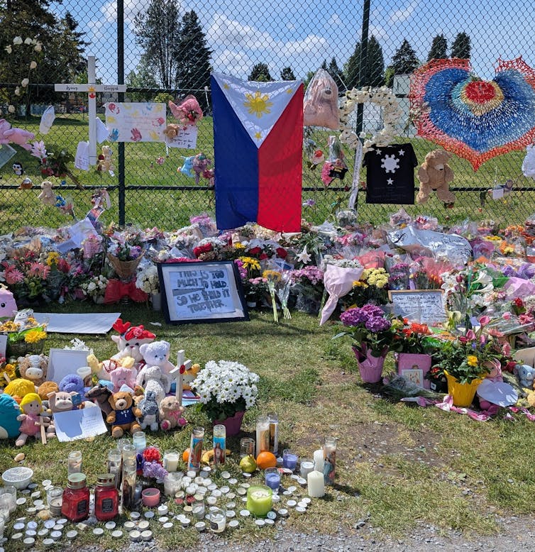 a makeshift memorial with the Filipino flag in the centre