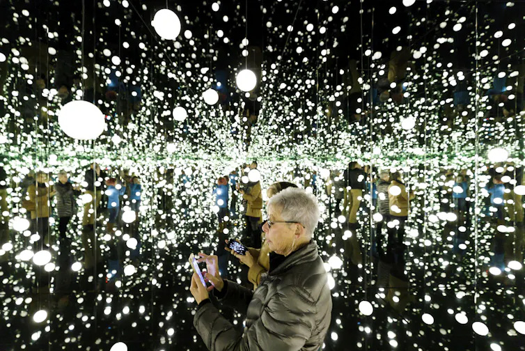 A room filled with white orbs and mirrors.