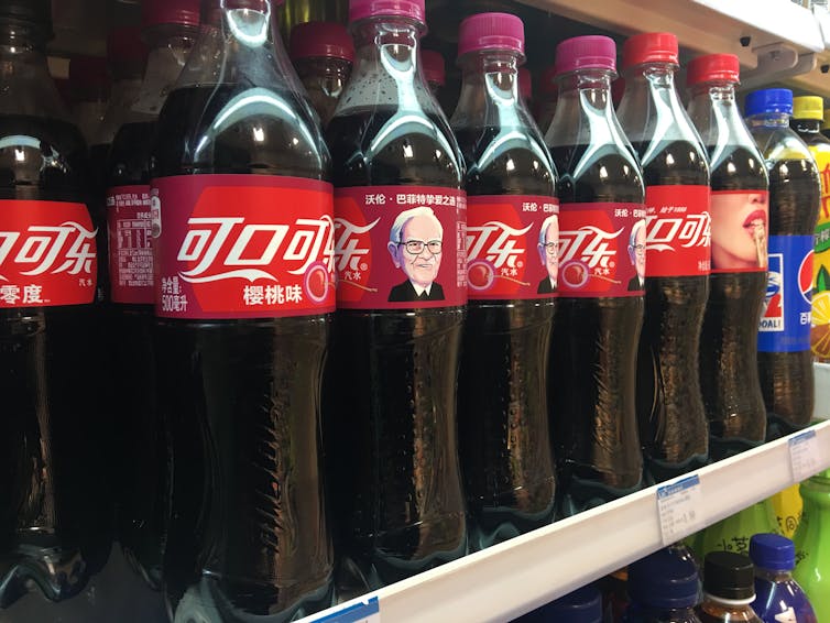 A cartoon of Warren Buffett printed on bottles of Coca-Cola for sale in China in 2017.