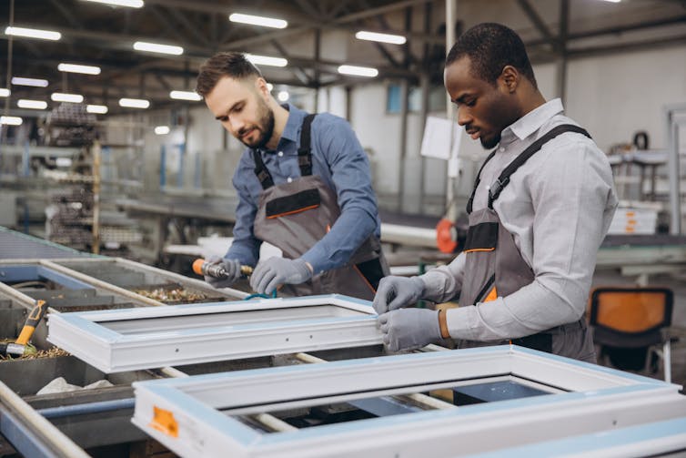 factory workers making windows.