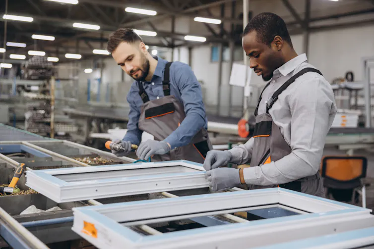 factory workers making windows.