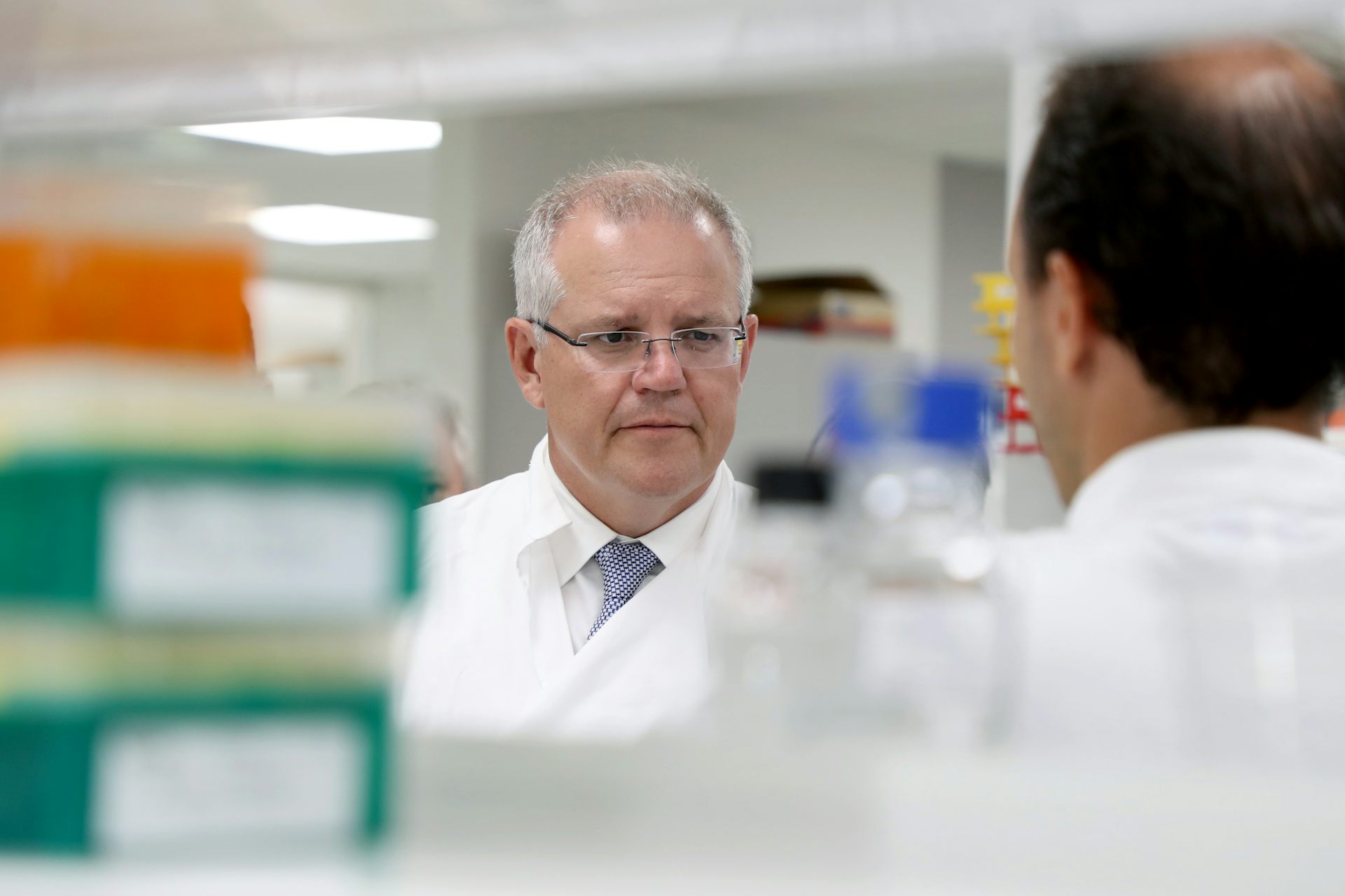 Former Prime Minister Scott Morrison in a white lab coat.