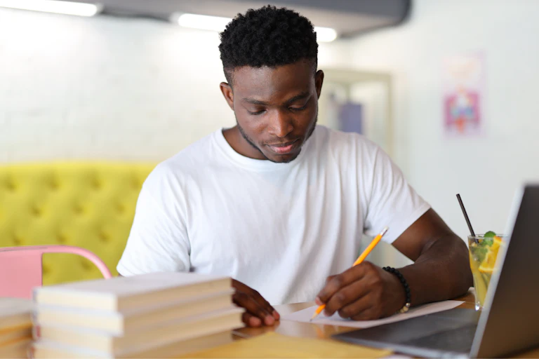 Young Black man studying