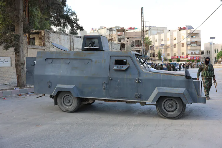 Syrian security forces securing an urban area.