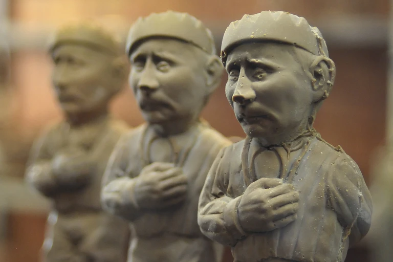 putin figure made from chocolate and depicted in a prisoner uniform