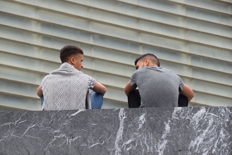 Are we able to pass judgement on an ethics, now not in courtroom, the case of a guide "Hate"? 1 Two young men speak on the street.